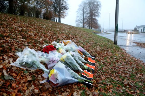 Flowers laid across from Lidl on McAlpine road Dundee where Mr Swan died.