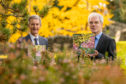 Dr Mark McGilchrist, Chair, Friends of the University Botanic Garden and Professor David Maguire, Interim Principal of the University, with one of the first printed copies of the book.