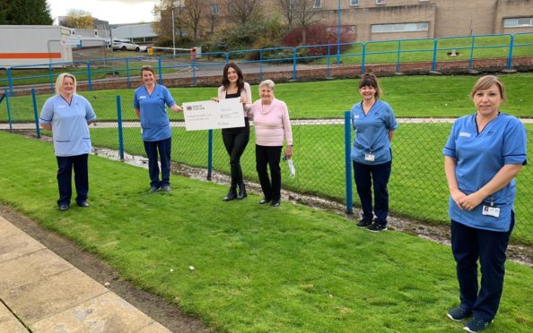Kerri Graham and proud grandmother Anna Graham are pictured handing over a £2000 cheque to PRI nurses and care staff Lynn Thomson, Susan Thomson, Trish Irvine and Lorraine Herbert in memory of Big County businessman Jim Graham.