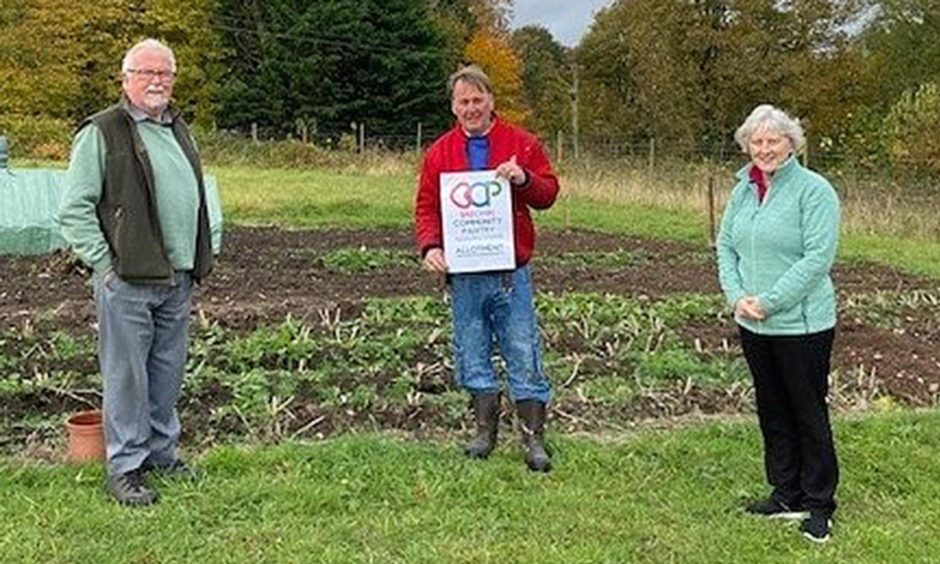 Ian Christie, left, with George Garden and Kathy Calderwood.