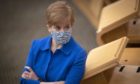 First Minister Nicola Sturgeon in the main chamber before First Minister's Questions at the Scottish Parliament in Edinburgh