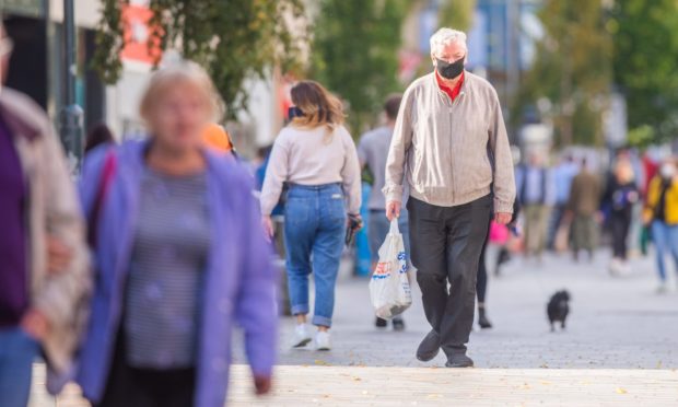 People wearing masks on the streets of Perth during the coronavirus pandemic.