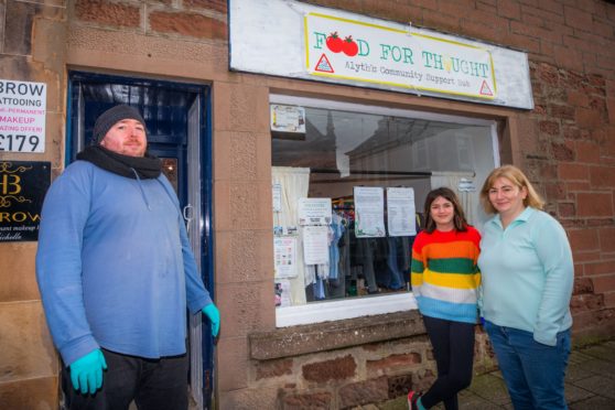 Darren Gracey with volunteers, Teagan Luscombe, 11 and  Pamela Luscombe.