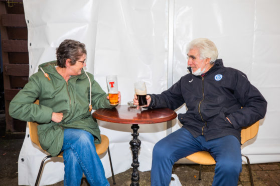 Doris Dickson and Bruce McAlpine enjoy a drink at The Malt House