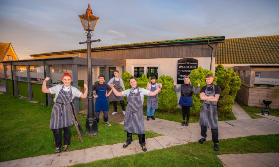 Hayley Wilkes (centre) with her staff.