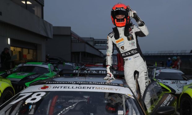 2020 British GT Champion Sandy Mitchell celebrates at Silverstone.