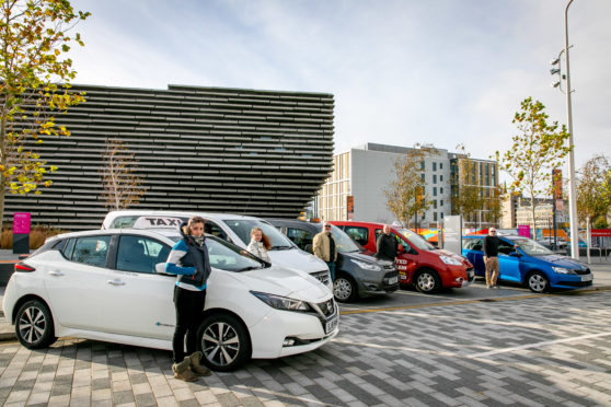 Dundee taxi drivers pull together in a stand to raise awareness of the need for support funding