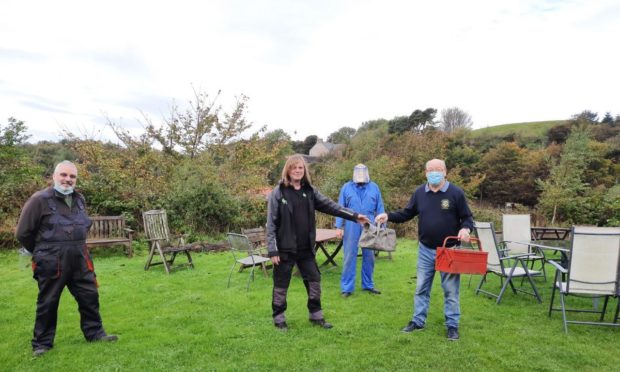 Ken Littlemore, Lee Brown and Bob Smith from the Tool Shed, with Tom Russell from Cowdenbeath Rotary Club.