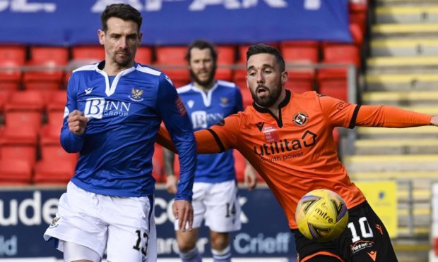 Craig Bryson battles for the ball with Nicky Clark.