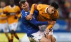 Jamie McCart battles with Tony Watt.