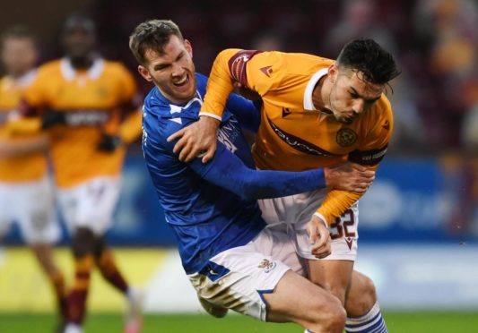 Jamie McCart battles with Tony Watt.