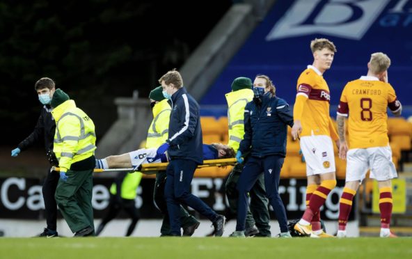 Murray Davidson is stretchered off.