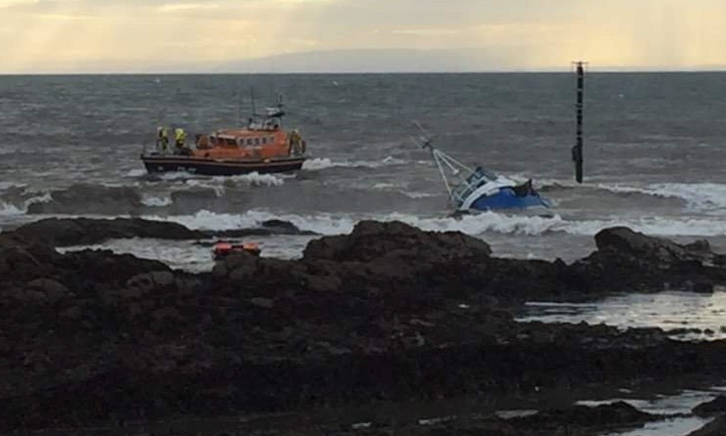 Two crew rescued after fishing vessel runs aground off Fife coast