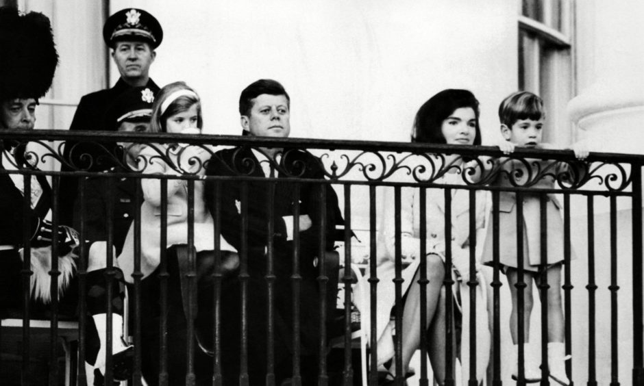 The Kennedy family gets a closer look at the famed Black Watch pipes and drums.