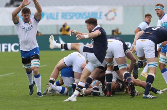 Ali Price kicks clear from a ruck in Scotland's win in Florence.