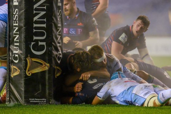 Prop Lee-Roy Atalifo goes over for Edinburgh's first-half try.