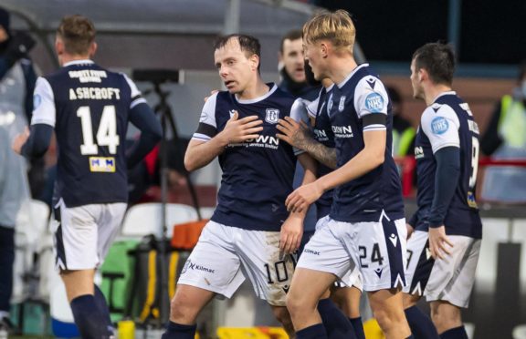 Dundee's Paul McGowan (centre) celebrates his winning goal against Arbroath.