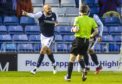 Dundee's Liam Fontaine celebrates in front of the home fans as he makes it 1-0.