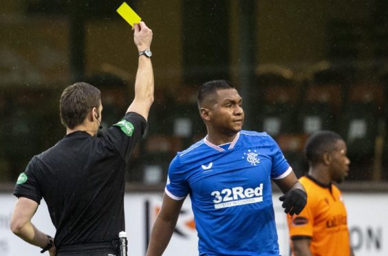 Alfredo Morelos gets only a yellow card for his foul on Mark Connolly.
