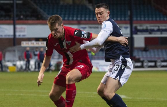 Dunfermline's Lewis Mayo (left) holds off Jordan Marshall during a Scottish Championship match between Dundee and Dunfermline at the Kilmac Stadium at Dens Park, on December 19, 2020.