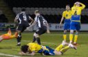 The St Johnstone defenders are disconsolate after St Mirren's late winner.