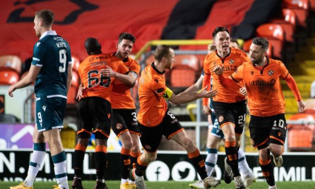 Dundee United star Nicky Clark celebrates his late equaliser.