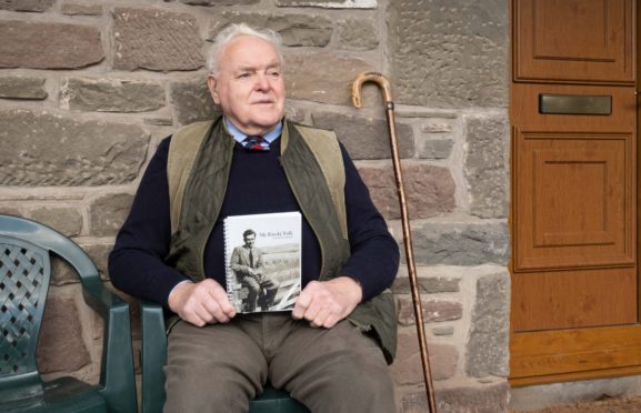 Kirriemuir Landward East community council chairman Ivan Laird with the book of poems.