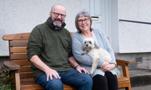 Alan and Val Mowatt with family dog Lily.