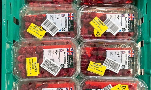 GREEN DEAL: Raspberries reduced in price in a shop to avoid food going to waste.