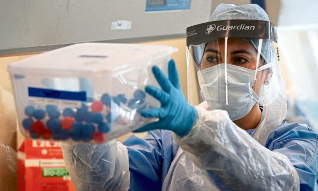 Live samples in test tubes are held in a container during the opening of the new Covid-19 testing lab at Queen Elizabeth University Hospital, Glasgow. PA Photo.