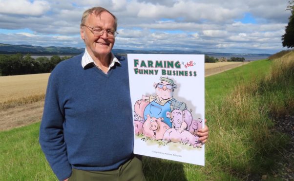 Andrew Arbuckle with the cover of his new charity book, which is raising funds for RSABI.