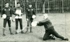 In the 1980s, Dundee European Cup goalie Bert Slater returned to Dens, assisting Jocky Scott with keeper coaching. Here he shows up-and-coming goalkeepers (from left) Bobby Geddes, Tom Carson and Paul Mathers how the master would do it.