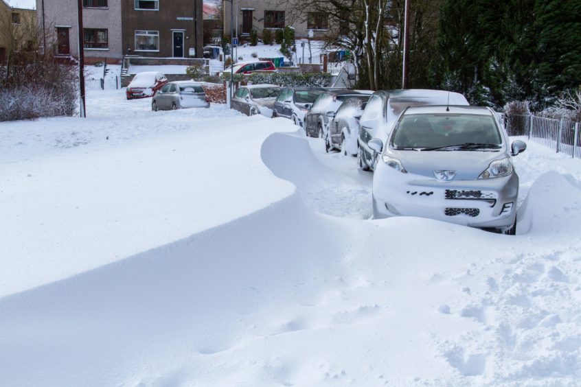 Snow drifts almost hide cars in Cardenden in early March 2018.