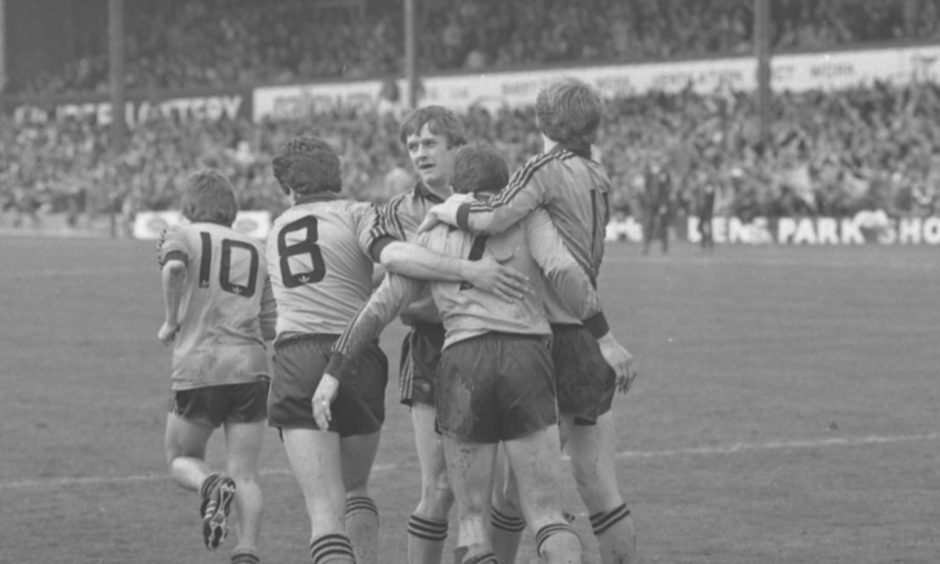 United celebrate Eamonn Bannon's goal in the 1983 game at Dens.