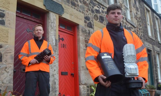 Openreach engineers, left, Elliot Kane and Jad Douglas in Lower Largo with the new fibre broadband technology.