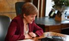 First Minister Nicola Sturgeon makes a 'kindness call' to Chris Smith and Freya Riley from Fife to back Chest, Heart and Stroke Scotland's Christmas loneliness campaign.