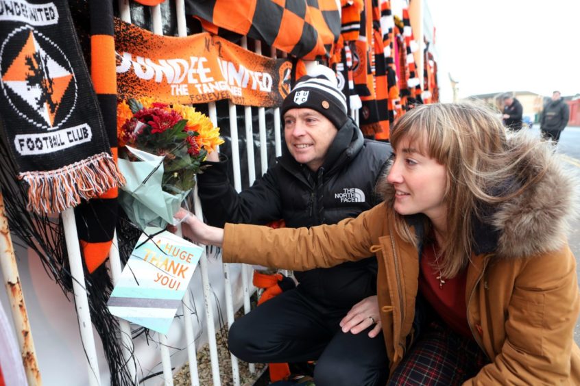 Dave Hart and Gemma Mulholland lay flowers.