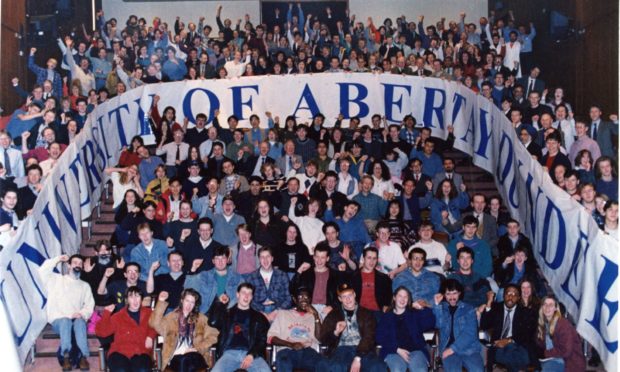 Students celebrate the success of the campaign to achieve university status.