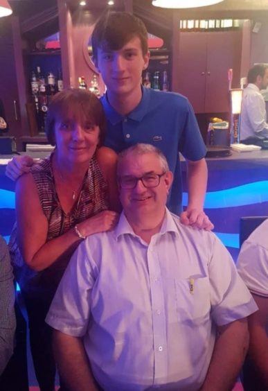 Henry Anderson with his wife Shirley and grandson Jordi.