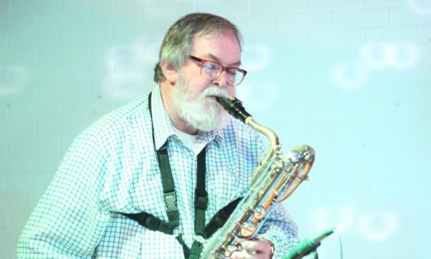 Jim Morrice playing his beloved saxophone