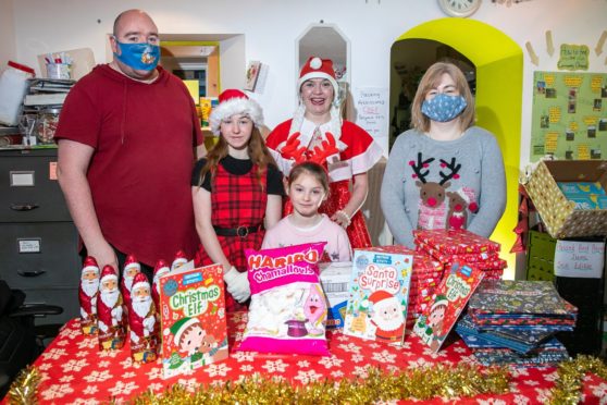 Darren Gracey, Cameron Gracey (13), Jett Young (8), Mrs Claus - Jennifer Donachy and Pamela Luscombe.