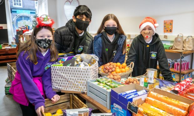 Langlands P7 pupils Aimee Cumming, Abdul Rehmat, Ashlyn Smith and Leo Brown, at S-Mart in West High Street, Forfar.