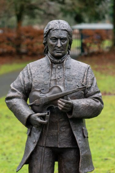 Niel Gow statue, man holding a fiddle