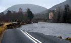 Part of the A93 near Crathie was washed away by flood waters during Storm Frank while Abergeldie Castle teetered on the brink of collapse.