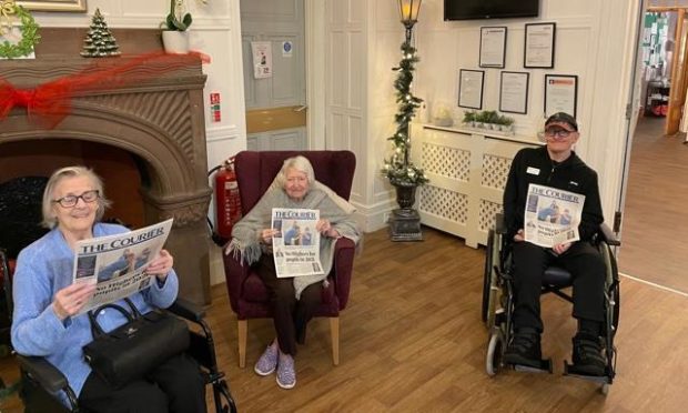 Elder Lea Manor residents with their copies of The Courier.