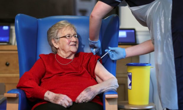 Resident Annie Innes, 90, receiving the Pfizer/BioNTech Covid-19 vaccine at the Abercorn House Care Home in Hamilton.