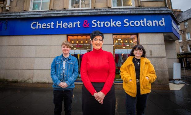Manager Sandra Kerr, alongside Perth Academy volunteers Brooke Sailor (right) and Nathan Hunter (left) outside Chest Heart and Stroke Scotland in Perth