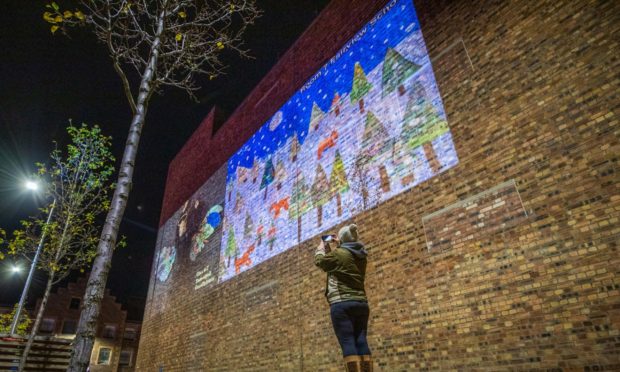 Kids Christmas cards projected on Mill Street, Perth