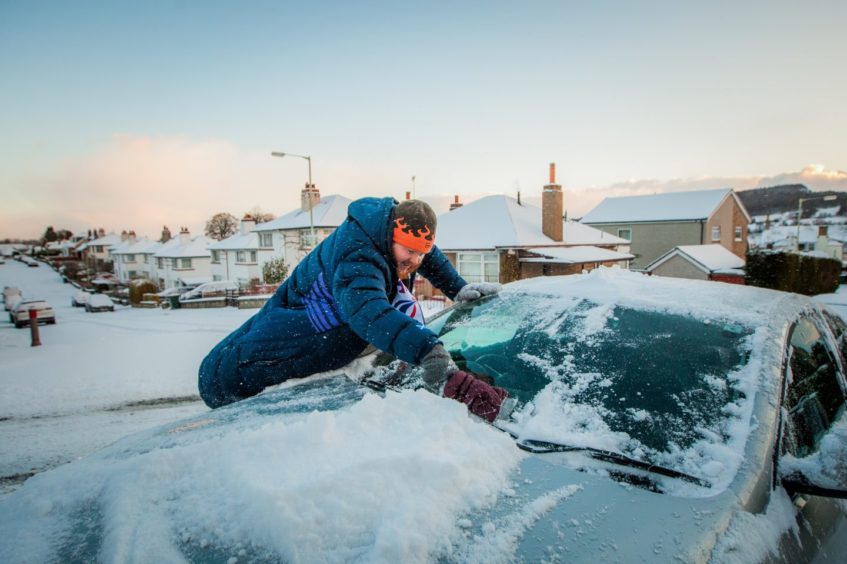 Richard Gray clearing his car for work. Glenlyon Road, Perth in February 2018.
