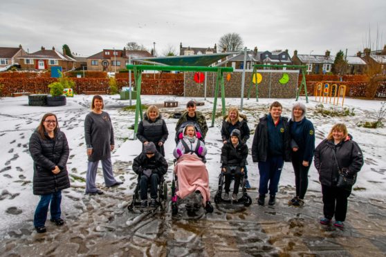 The community council, learners, staff and head teacher Jackie Urquhart in the existing school playground which they hope to transform.